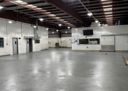 Seafood processing plant flooring installation in California using epoxy and urethane