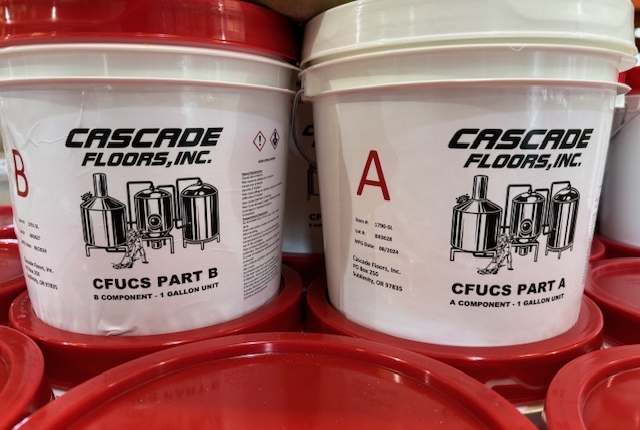 Containers of Cascade Floors In House proprietary epoxy flooring system for commercial use